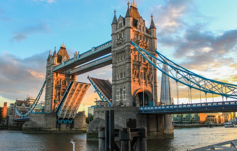 a bridge spanning over a body of water, a picture, by Joseph Henderson, shutterstock, tower bridge, usa-sep 20, two giant towers, discovered photo