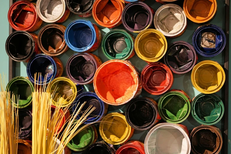 a close up of a bunch of buckets of paint, inspired by James Rosenquist, pexels, full of colour 8-w 1024, sustainable materials, glass paint, rich colours