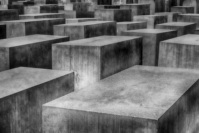 a black and white photo of a bunch of concrete blocks, inspired by Adolf Dietrich, trending on pixabay, humanity's last sacrifice, tourist photo, dead soldiers, vertical lines