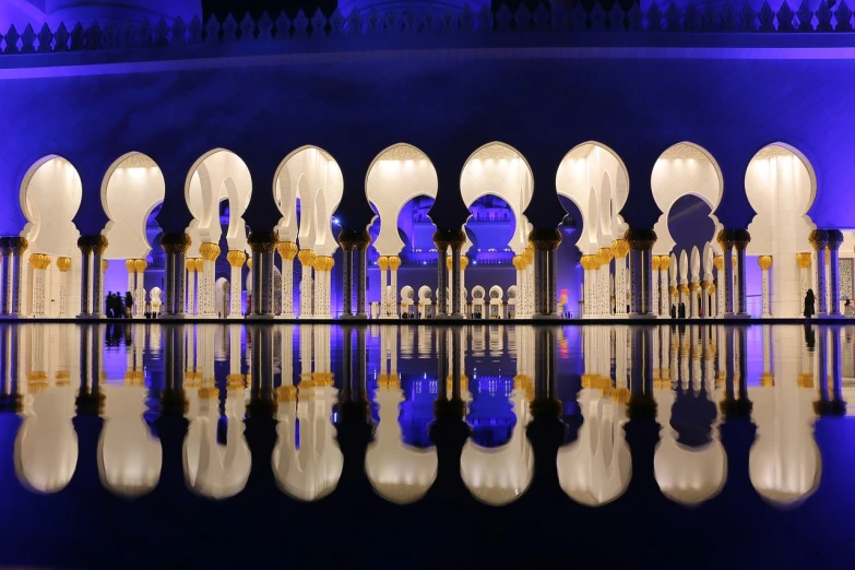 a reflection of arches in a pool of water, by Sheikh Hamdullah, arabian night, gaudy, 2 0 2 2 photo