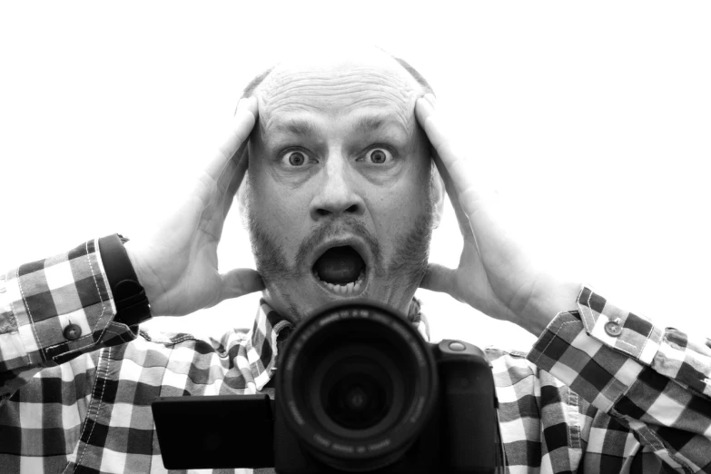 a man holding a camera in front of his face, inspired by Richard Avedon, art photography, shocked look, headshot profile picture, graham humphreys, high key