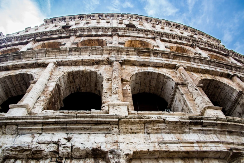 a close up of a building with a sky background, by Alessandro Allori, shutterstock, in a coliseum, spectacular details, view from side, usa-sep 20