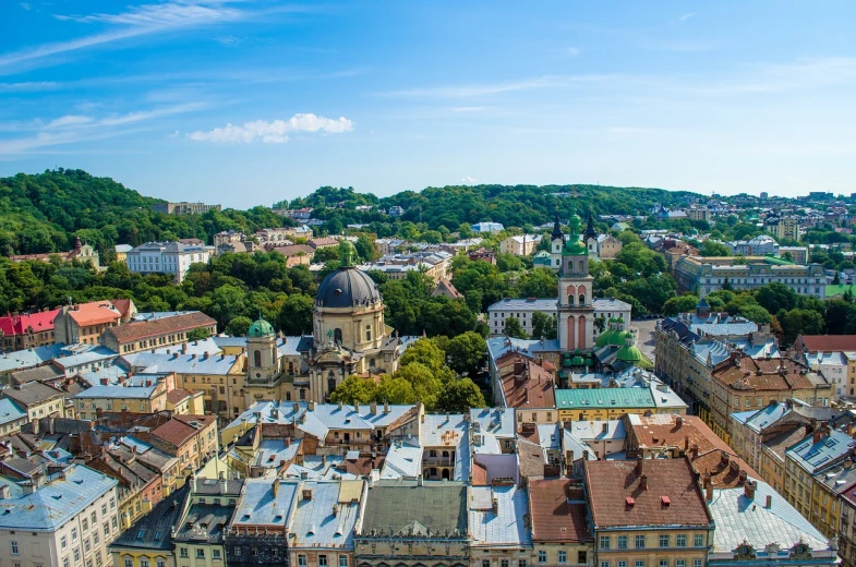 a view of a city from the top of a building, by Aleksander Gierymski, shutterstock, baroque, lviv, ultrawide angle cinematic view, summer day, srgb