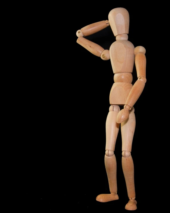 a wooden mannequin standing in front of a black background, by Edward Corbett, pexels, frustrated detailed, tiny person watching, fullbody photo, looking upwards