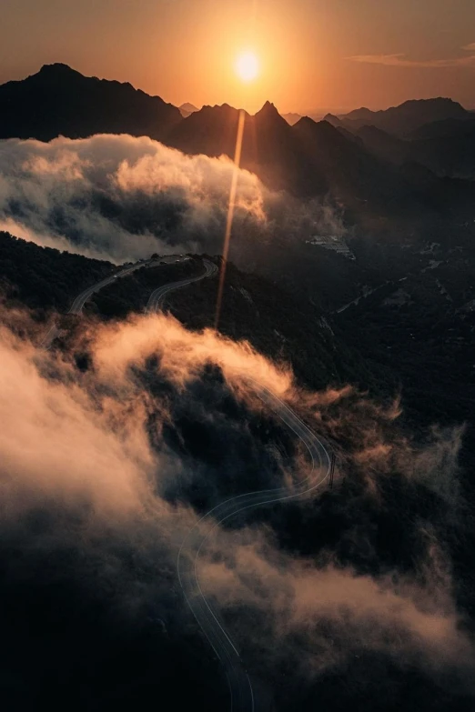the sun is setting over the mountains above the clouds, by Etienne Delessert, unsplash contest winner, conceptual art, drone photograpghy, bursting with holy light, realism | beeple, artistic. alena aenami
