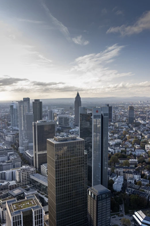 a view of a city from the top of a building, by Dietmar Damerau, shutterstock, herzog de meuron, germany, high - angle view, november