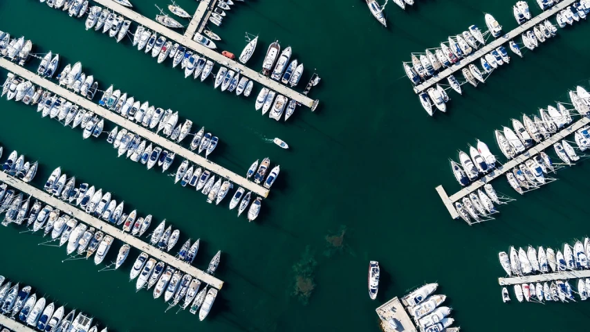 a number of boats in a large body of water, pexels contest winner, top down photo at 45 degrees, docked at harbor, istock, complex and detailed