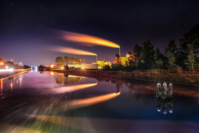 a boat traveling down a river at night, a picture, by Thomas Häfner, smokestacks, marvellous reflection of the sky, time - lapse, the photo was taken from afar