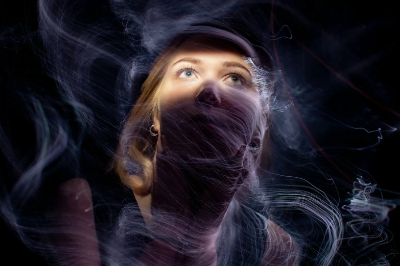 a woman with smoke coming out of her mouth, a portrait, inspired by Anna Füssli, shutterstock, digital art, volumetric light from below, cosmic energy wires, camera looking up at her, photo of the girl