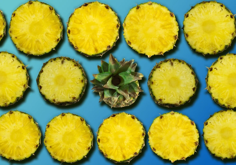 a pineapple cut in half on a blue surface, a stock photo, by Jon Coffelt, pop art, seamless texture, 6 pack, n - 6, start
