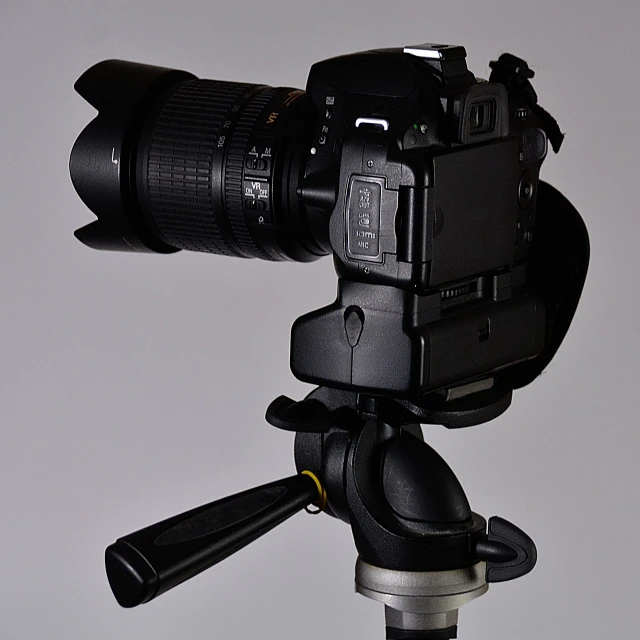 a close up of a camera on a tripod, professional product photography, nikon d 8 0 7, 35 mm product photo”