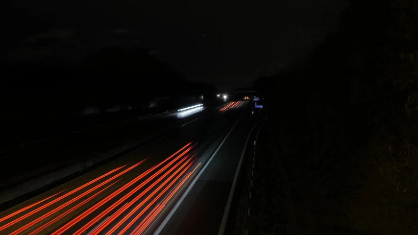 a long exposure shot of a highway at night, a picture, figuration libre, reportage photo, high res photo