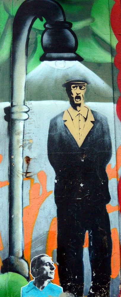 a painting of a man on the side of a building, graffiti art, by Andrei Kolkoutine, flickr, nathan fielder and groucho marx, subject detail: wearing a suit, dave mckean ink drips, george orwell