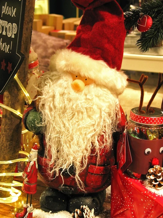 a close up of a santa claus figurine on a table, pexels, folk art, lots of decoration and furniture, !! looking at the camera!!, zoomed out shot, ebay photo