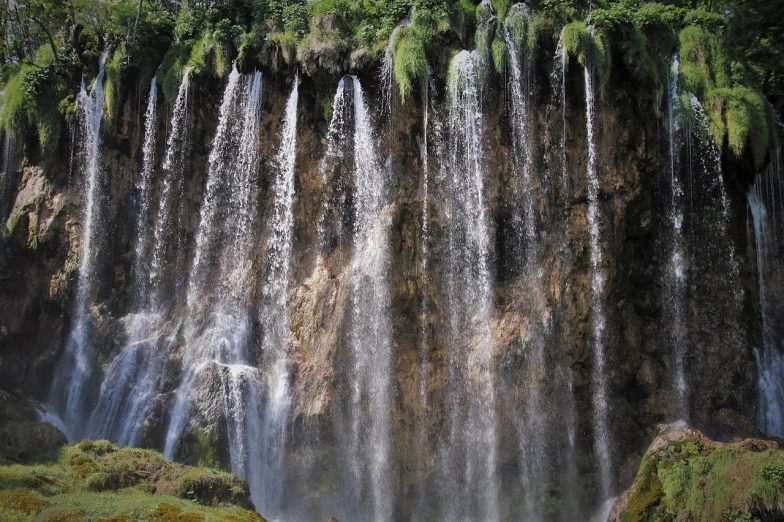 a group of people standing in front of a waterfall, inspired by Mirko Rački, flickr, hurufiyya, closeup!!, floating waterfalls, heaven!!!!!!!!, taras susak