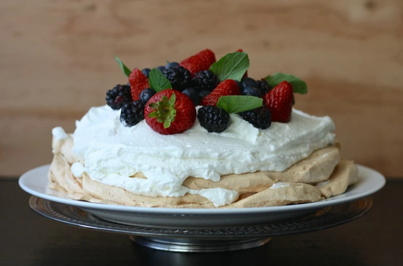 a close up of a cake on a plate on a table, inspired by Ed Benedict, “berries, whipped cream on top, photograph credit: ap, diy