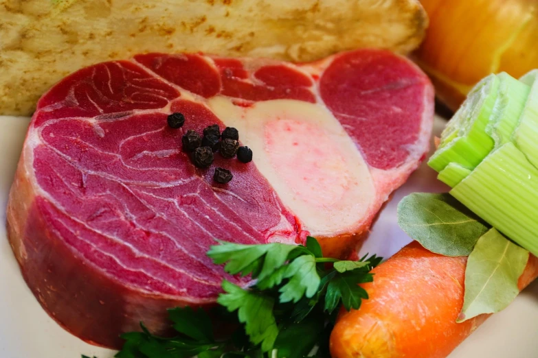 a white plate topped with meat and vegetables, by Thomas Häfner, figuration libre, closeup of a butcher working, close-up product photo