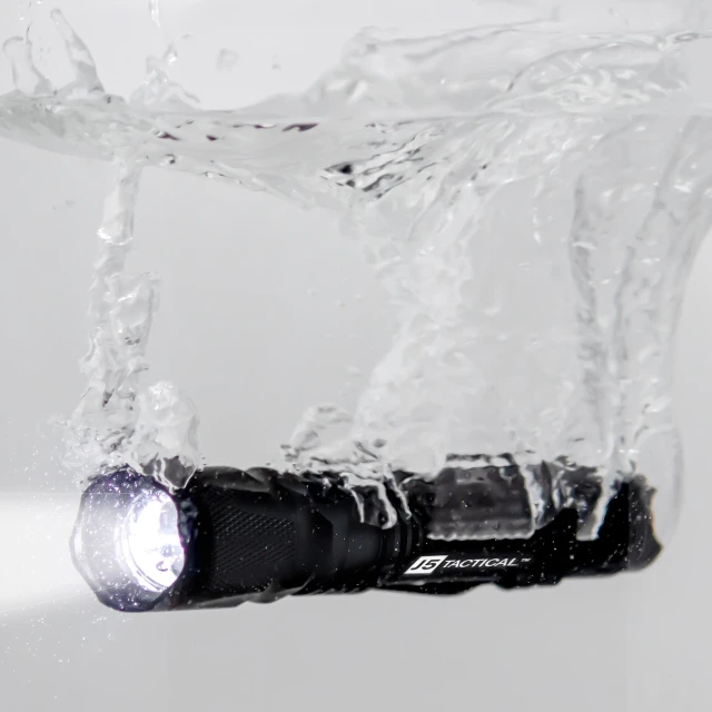 a close up of a flashlight in the water, renaissance, professional product photography, zenithal lightning, 300 dpi, productphoto