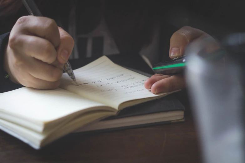 a person writing in a notebook with a pen, happening, trying to study, featured, retro vibe, liam brazier