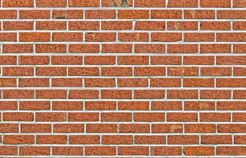 a fire hydrant in front of a brick wall, a stock photo, shutterstock, fine art, stereogram, cement brick wall background, wide screenshot, orange