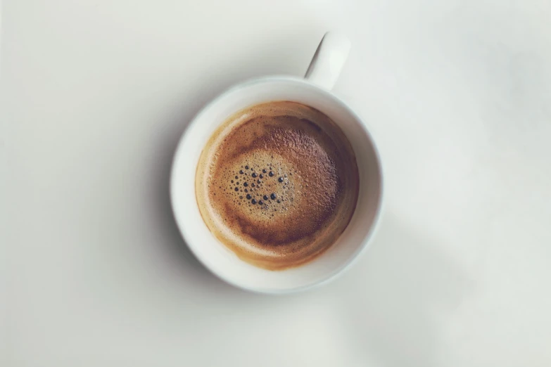 a close up of a cup of coffee on a table, minimalism, wide shot photo, hyperdetailed crisp render, official product photo, very beautiful photo