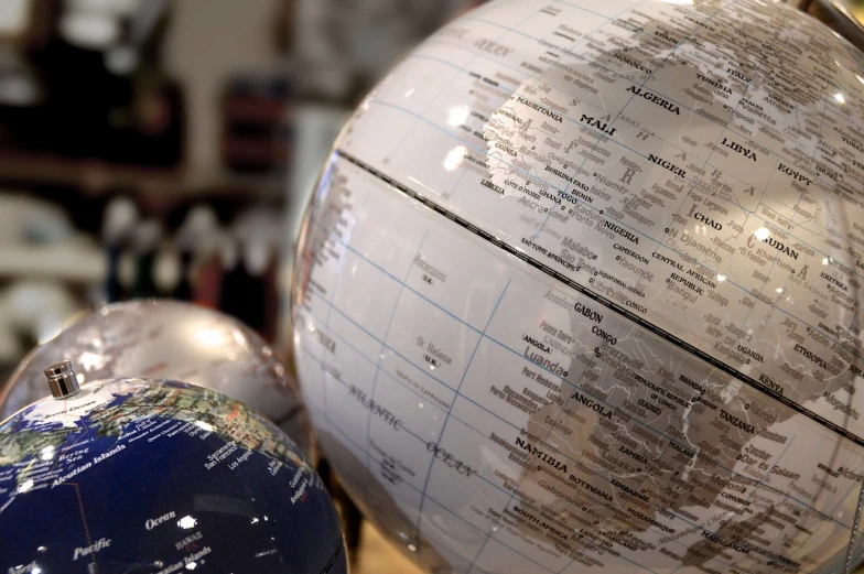 a close up of a globe on a table, by Kurt Roesch, flickr, panorama, hyperdetailed, high gloss, insanely detail