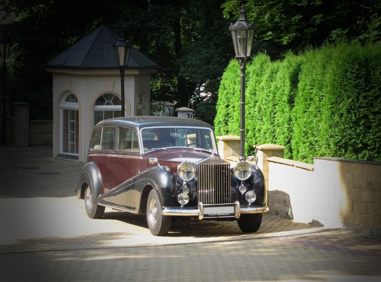 a vintage car parked on the side of the road, by Jan Stanisławski, pixabay contest winner, bauhaus, luxurious environment, bentley, ukraine, july 2 0 1 1