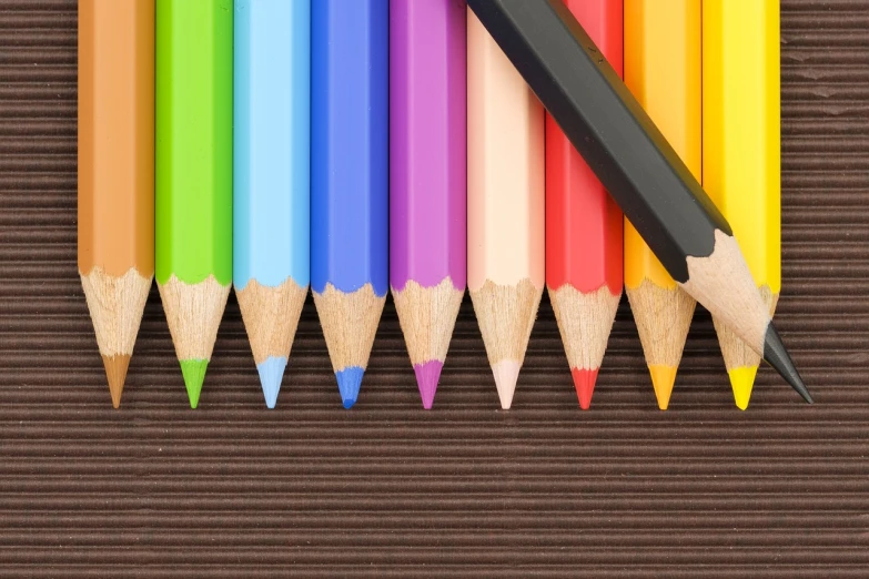 a group of colored pencils sitting next to each other, a color pencil sketch, 1128x191 resolution, istock, over saturated colors, lined up horizontally