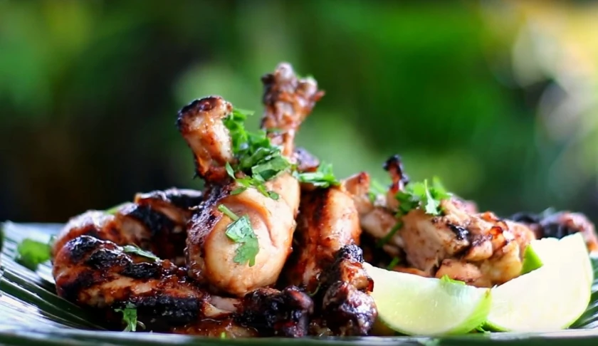 a close up of a plate of food on a table, grilled chicken, video still, amazing background, featured