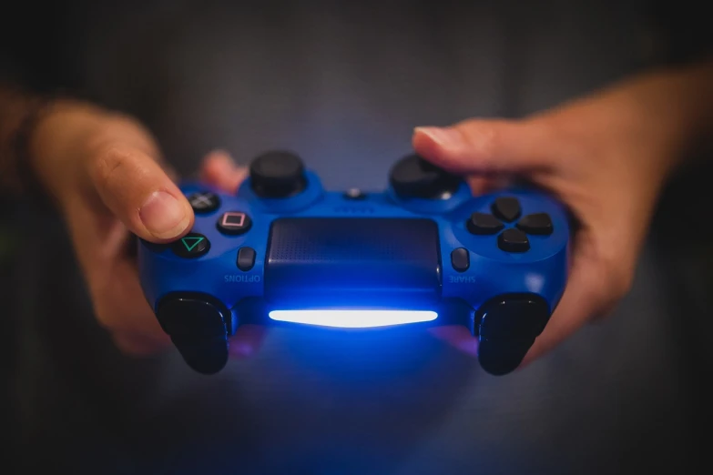 a close up of a person holding a video game controller, blue accent lighting, ps 4, video game asset, video game screenshot>