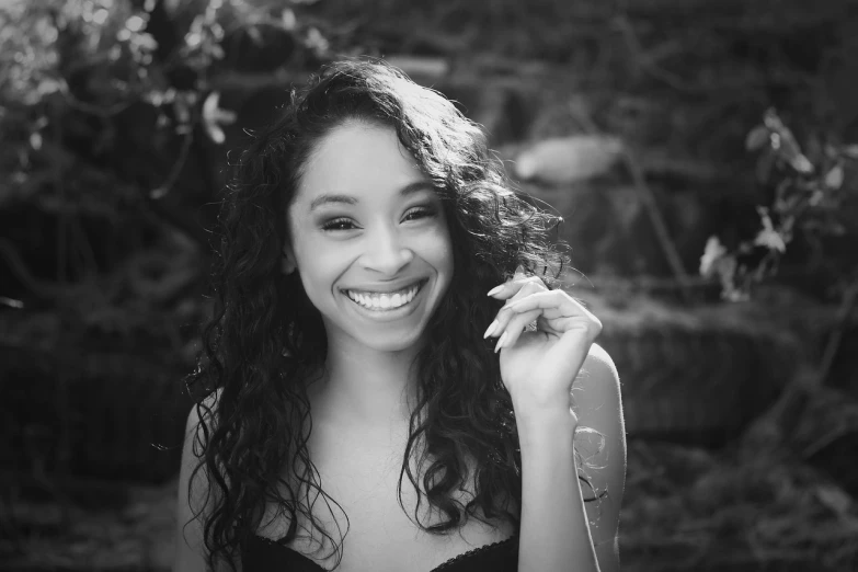 a black and white photo of a woman smiling, a black and white photo, by Stokely Webster, vanessa morgan, warm weather, avatar image, oona chaplin