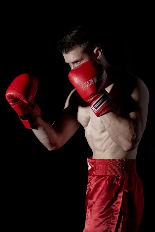 a shirtless man wearing red boxing gloves, a portrait, figuration libre, usa-sep 20, dramatic powerful pose, killian eng, fully body photo