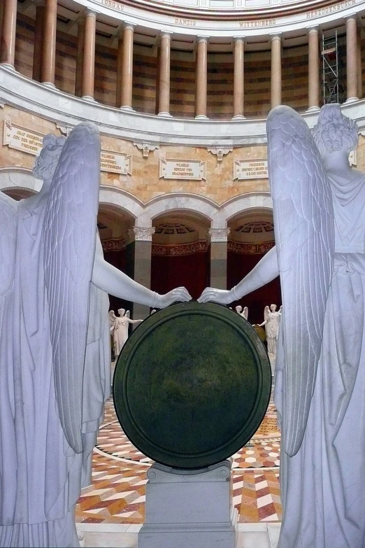 a couple of statues that are inside of a building, a marble sculpture, by Jon Coffelt, flickr, angel halo, rotunda, holding a huge shield, view from inside