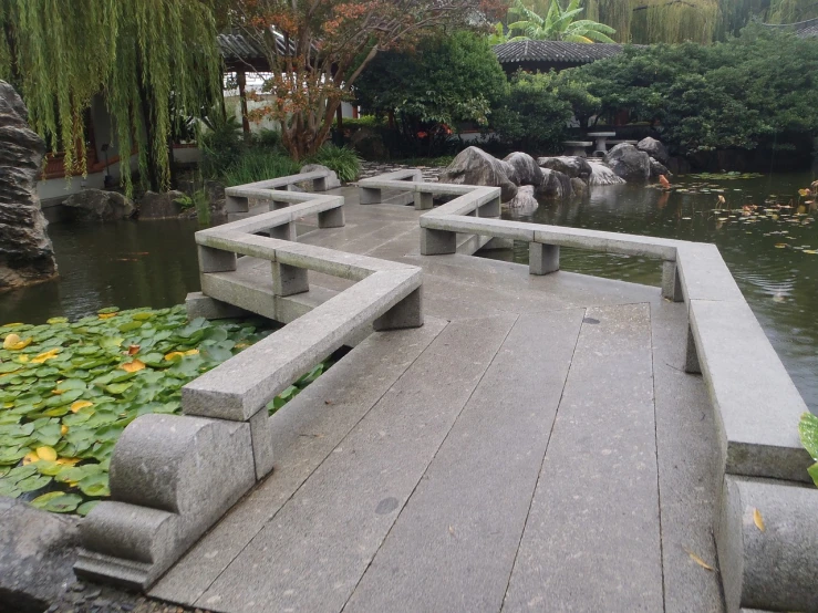 a stone bench sitting on top of a wooden bridge, inspired by Sesshū Tōyō, concrete art, wang liang, you can see all the passageways, very very elegant, conversation pit