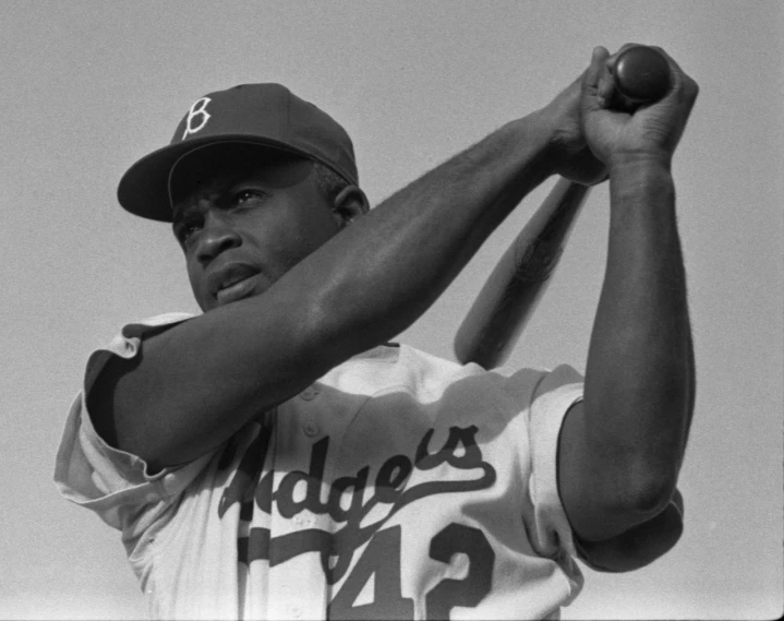 a black and white photo of a baseball player holding a bat, a portrait, black man, moss, blues, upper body close - up