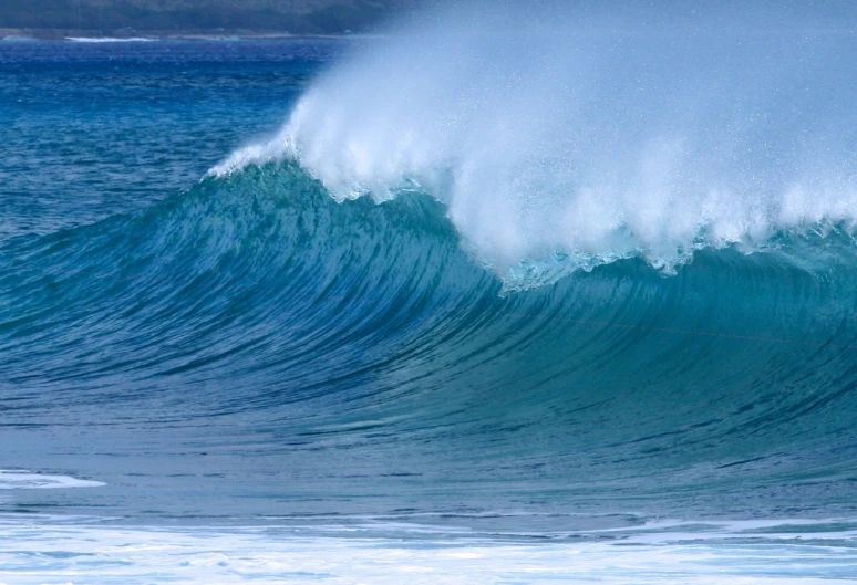 a man riding a wave on top of a surfboard, a picture, by Ken Elias, fine art, blue crashing waves, maui, the photo shows a large, azure waves of water