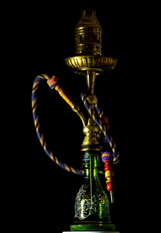 a hook that is sitting on top of a table, by Youssef Howayek, hurufiyya, colorful vapor, in style of thawan duchanee, highdetailed, nigth