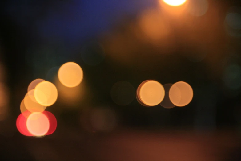 a blurry photo of a street at night, by Andrew Domachowski, flickr, macro bokeh ”, orbs, summer night, soft light - n 9