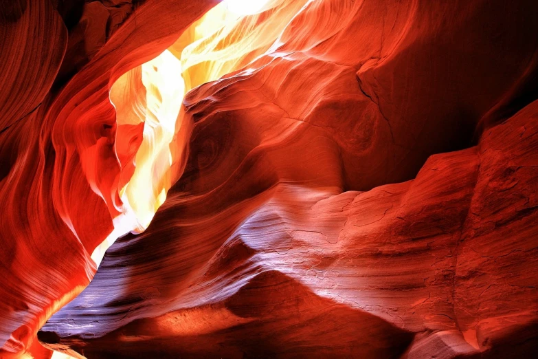 an image of the inside of a canyon, by Paul Emmert, shutterstock, flame stones are scattered, curves!!, closeup photo, red cloud light