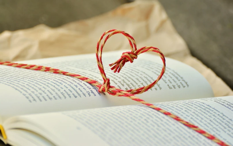 a book with a string in the shape of a heart, pixabay, friendship, amazing beauty, pillar, cute:2