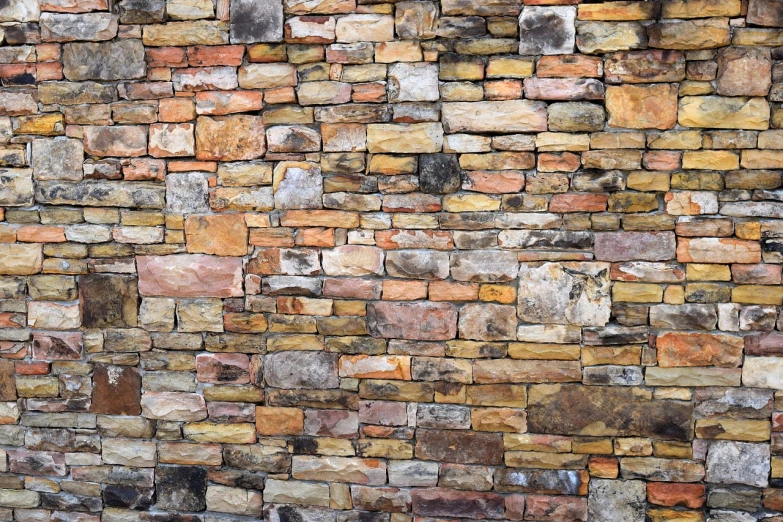 a red fire hydrant sitting in front of a brick wall, by Linda Sutton, renaissance, stylized stone cladding texture, many small and colorful stones, rustic stone cabin in horizon, walls with tone of yellow