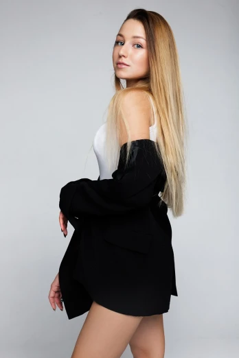 a woman with long blonde hair posing for a picture, minimalism, open jacket, high detail product photo, young female in black tuxedo, long hair straight down