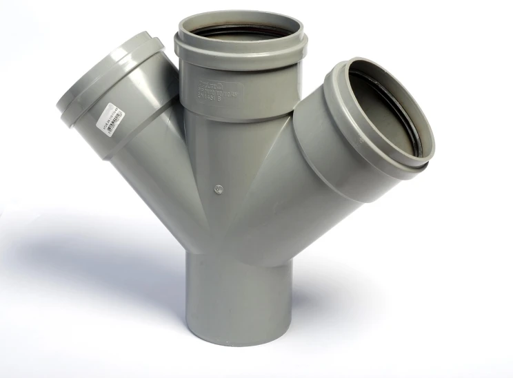 a close up of a metal pipe on a white surface, a picture, by Tom Scott RSA, shutterstock, plasticien, symmetrical front view, three head one body, sewer, pot