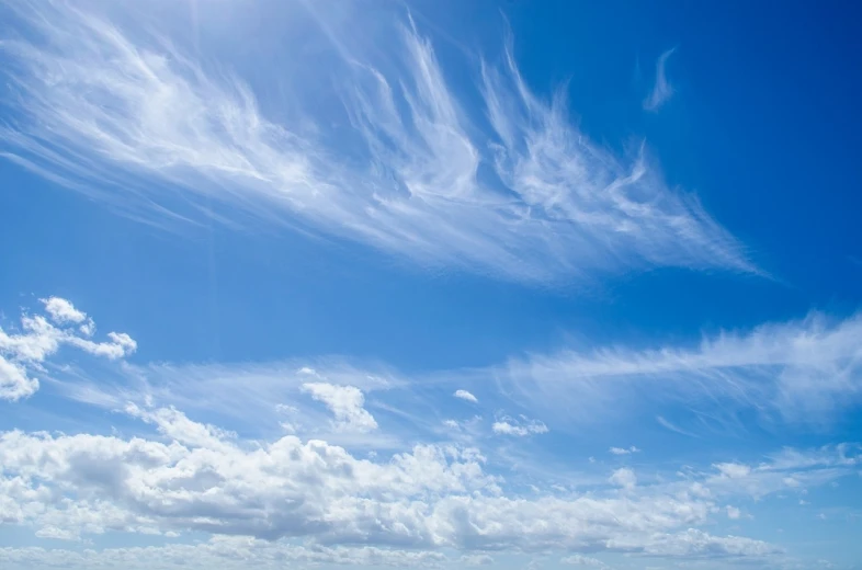 a couple of people on a beach flying a kite, by John Murdoch, wispy clouds in a blue sky, panorama view of the sky, angels in the sky, beautiful sky with cumulus couds