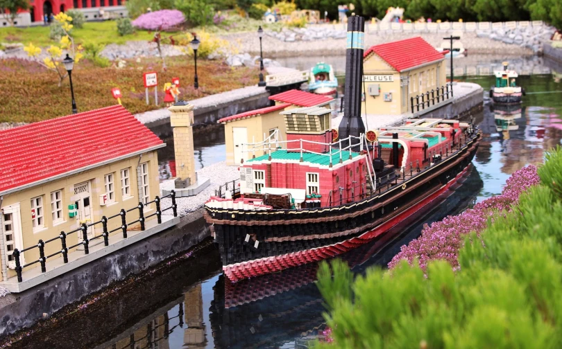 a model of a boat on a body of water, a tilt shift photo, by Jim Nelson, folk art, theme park, lego city, canal, detail shots