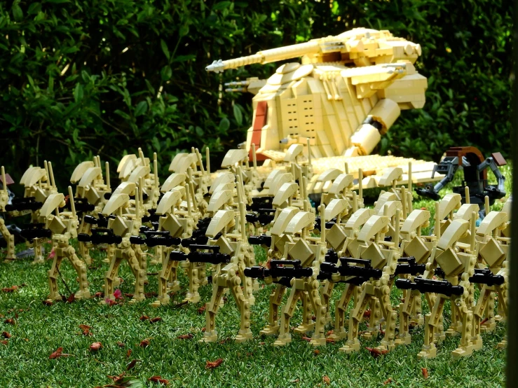 a row of legos sitting on top of a lush green field, by Edward Corbett, flickr, digital art, general grievous from star wars, soldiers running, malayalis attacking, very elegant & complex