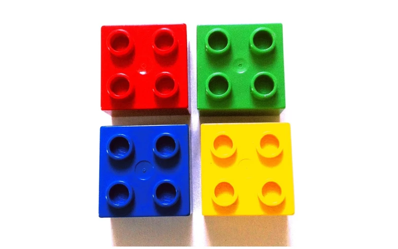 a group of four lego blocks sitting next to each other, inspired by Josef Block, flickr, top view, viewed from below, ebay, ffffound