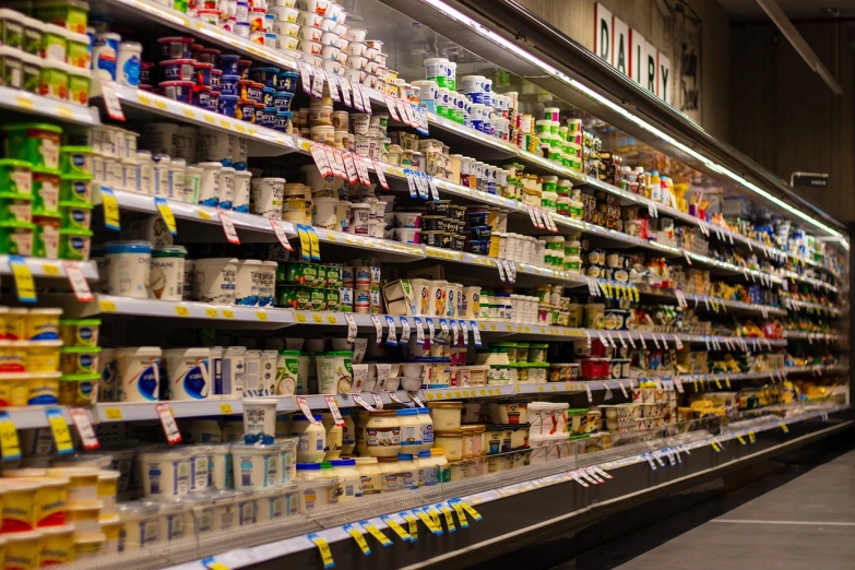 a grocery store filled with lots of milk and yogurt, a picture, pexels, hyperrealism, stock photo, high res photo, cheeses, early evening