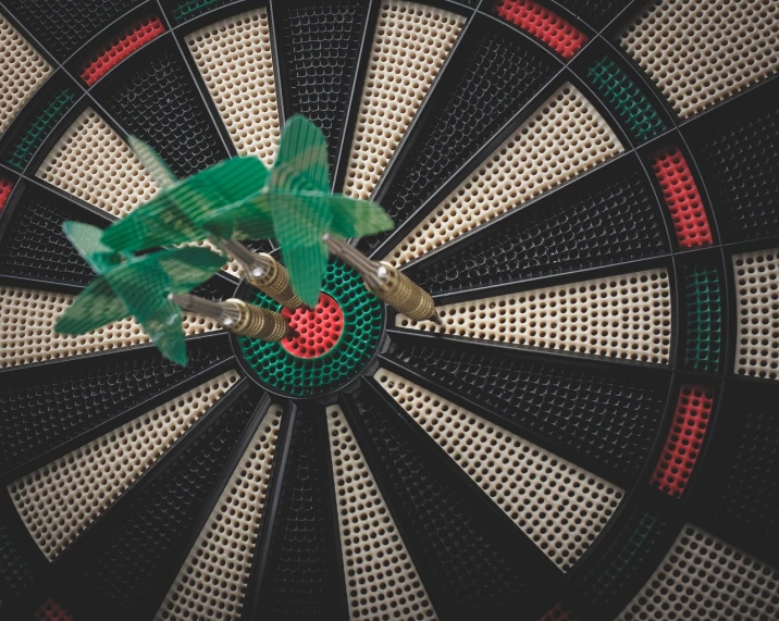 a dart with three darts in the middle of it, pexels contest winner, precisionism, a green, air shot, interrupting the big game, target reticles