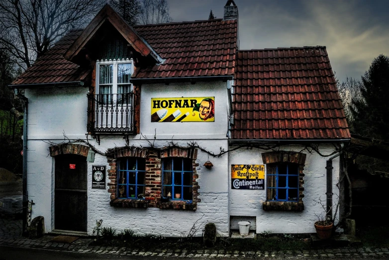 a building with a sign on the front of it, by Thomas Häfner, pixabay, a multidimensional cozy tavern, hotdogs, lower saxony, vibrant but dreary